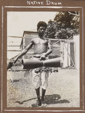 A man holding a drum, Port Moresby, 1914