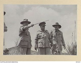 NADZAB, NEW GUINEA. 1945-05-11. GENERAL SIR THOMAS A. BLAMEY, COMMANDER-IN-CHIEF, ALLIED LAND FORCES, SOUTH WEST PACIFIC AREA (1), ACCOMPANIED BY SENIOR OFFICERS, INSPECTING THE SITES FOR NEW ..