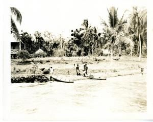 [Gaudalcanal River Shoreline With Canoes And Melanesian People]