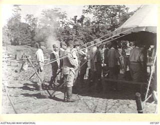 BUIN AREA, BOUGAINVILLE. 1945-09-13. JAPANESE STAFF OFFICERS WAITING OUTSIDE THE MARQUEE BEFORE A CONFERENCE WITH AUSTRALIAN OFFICERS AT HEADQUARTERS 2 CORPS SURRENDER PARTY CAMP IN KAHILI AREA TO ..