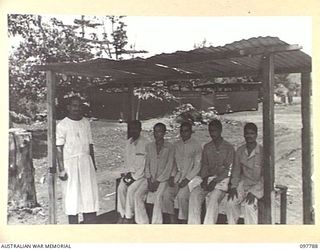 RABAUL, NEW BRITAIN, 1945-10-08. A GROUP OF INDIAN DENTAL PATIENTS IN THE WAITING ROOM AT THE DENTAL SECTION, 105 CASUALTY CLEARING STATION