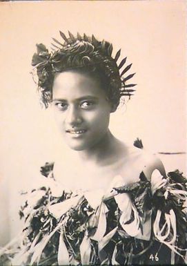 Slick-haired woman with leaf headwreath