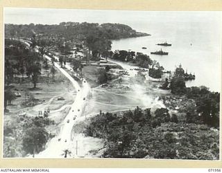 LANGEMAK BAY, NEW GUINEA. 1944-04-03. AN AERIAL PHOTOGRAPH INDICATING THE PORT DEVELOPMENT AND THE INCREASED MOVEMENT OF SUPPLIES THROUGH THE AREA. THE ROADWAY LOADING TO THE LEFT OF THE PICTURE ..