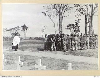 TOROKINA, BOUGAINVILLE, 1945-08-17. THE FUNERAL AT THE WAR CEMETERY OF CAPTAIN P.V. STRUGNALL CORPS OF AUSTRALIAN ELECTRICAL AND MECHANICAL ENGINEERS HEADQUARTERS 2 CORPS WHO DROWNED WHILE SWIMMING ..