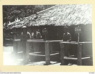 MALAHANG, NEW GUINEA. 1944-04-23. THE HONOURABLE E.J. WARD, MINISTER FOR EXTERNAL TERRITORIES IN THE AUSTRALIAN GOVERNMENT (1), FOLLOWED BY MAJOR-GENERAL B.M. MORRIS, DSO, GOC, AUSTRALIAN NEW ..