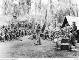 Yamil No. 1 - Maprik Area, New Guinea. 1945-07-14. The band of the Waratah concert party entertains troops within 500 yards of Japanese positions