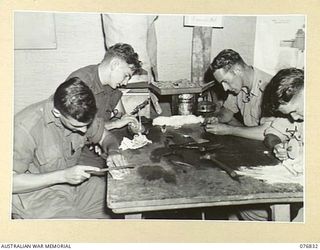 LAE, NEW GUINEA. 1944-11-11. PATIENTS WORKING IN THE HOBBIES HUT AT THE 112TH CONVALESCENT DEPOT. IDENTIFIED PERSONNEL ARE: VX111842 PRIVATE F.J. PRIDMORE, 2/1ST GUARD REGIMENT (1), VX115916 ..