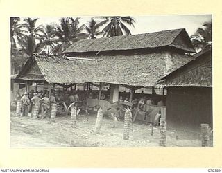 MILNE BAY, NEW GUINEA, 1944-02-12. THE DINING SECTION OF THE TROOPS' CLUB, ESTABLISHED BY THE AUSTRALIAN ARMY CANTEENS SERVICE AND NOW PATRONIZED CHIEFLY BY AMERICAN SERVICEMEN