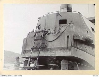 NANTAMBU, NEW BRITAIN, 1945-07-26. SAPPERS OF A DETACHMENT, 53 PORT CRAFT COMPANY, REPAIRING UNDER WATER GEAR ON THE BARGE AB1236. IDENTIFIED PERSONNEL ARE:- CORPORAL J.P. KELLY (1); SAPPER J.R. ..