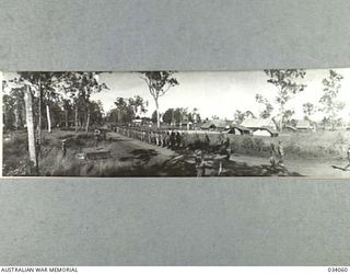 Wondecla, Qld. 27 May 1944. Panoramic view of the 2/6th Australian Infantry Battalion marching past the saluting base on the new Cairns-Herberton Road after taking part in an inspection of the ..