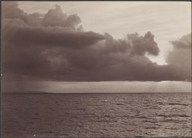 Sunset off the western coast of Te Motu from the entrance of Graciosa Bay, Santa Cruz Islands, Solomon Islands, 1906 / J.W. Beattie