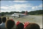 Group watch as Frances Harwood boards airplane
