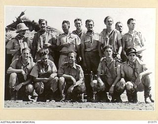 1942-09-03. AMONG THIS GROUP OF PILOTS NOW OPERATING IN NEW GUINEA ARE MEN WHO FLEW WITH THE FAMOUS RAAF DESERT SQUADRON IN THE MIDDLE EAST. THE OFFICER STANDING ON THE EXTREME LEFT (WEARING A ..