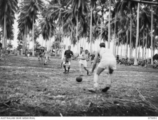 MILILAT, NEW GUINEA. 1944-08-06. A TENSE MOMENT DURING THE SOCCER MATCH BETWEEN TEAMS FROM THE 4TH INFANTRY BRIGADE AND HEADQUARTERS, 5TH DIVISION DURING THE FIRST GAME PLAYED ON THE NEW ..