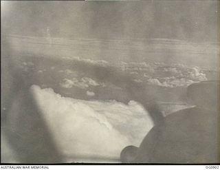 BISMARCK ARCHIPELAGO. 1944-03-28. PART OF NEW BRITAIN AS SEEN FROM A BEAUFIGHTER AIRCRAFT OF NO. 30 SQUADRON RAAF FLOWN BY FLIGHT SERGEANT T. BOEHM OF SA, AS ESCORT AIRCRAFT, OF NO. 79 (SPITFIRE) ..