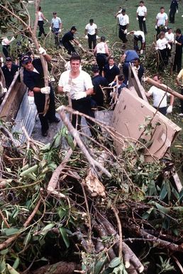 Naval personnel from Naval Air Station, Agana, Guam, take part in clean-up efforts at Pedro C. Lujan School in the aftermath of Typhoon Omar which struck the area on August 28th