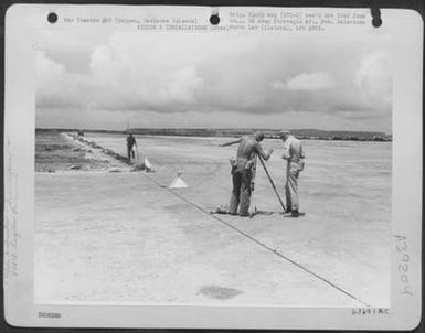 804Th Engineer Aviation Battalion Survey Crew Laying Outline Of Aslito Airfield On Saipan, Maianas Islands. 25 June 1944. (U.S. Air Force Number 63691AC)