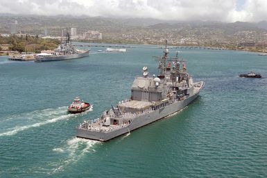Stern view of the US Navy (USN) Ticonderoga Class Guided Missile Cruiser USS VINCENNES (CG 49) entering Pearl Harbor, Hawaii (HI), for a scheduled port visit. This is the ship's last port call before being decommissioned at San Diego, California (CA)