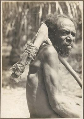 Old man with stone adze, Mukawa / Frank Hurley