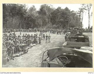 MILFORD HAVEN, LAE, NEW GUINEA. 1944-11-01. TROOPS OF THE 4TH FIELD REGIMENT BOARDING UNITED STATES ARMY AMPHIBIOUS DUKW'S FOR TRANSPORT OUT TO THE LIBERTY SHIP, LINDLEY M. GARRISON FOR THE UNIT ..