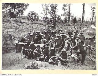 RABAUL, NEW BRITAIN, 1945-09-11. TROOPS OF C COMPANY, 37/52 INFANTRY BATTALION, TAKE A TEA BREAK FROM THEIR DUTIES DURING EARLY STAGES OF THE OCCUPATION OF RABAUL BY 4 INFANTRY BRIGADE AFTER THE ..