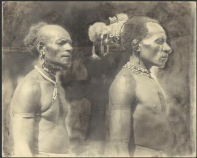 Two Ramu Delta men one of whom is wearing a cuscus fur headdress, Awar, Sepik River, New Guinea, 1935 / Sarah Chinnery