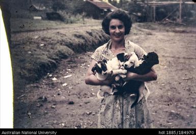 Woman holding puppies