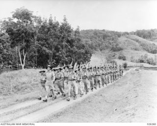 PAPUA. 1942-08-18. TROOPS OF THE 7TH AUSTRALIAN DIVISIONAL ARMY SERVICE CORPS ON A TRAINING MARCH IN MOUNTAIN COUNTRY IN THE HIKINUMU DISTRICT