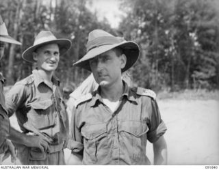 Lieutenant Colonel B J Callinan, Commanding Officer 26th Infantry Battalion (right), and Major H J Berry, Officer Commanding 11th Battery, 4th Field Regiment (left), taken during a tour of the area ..