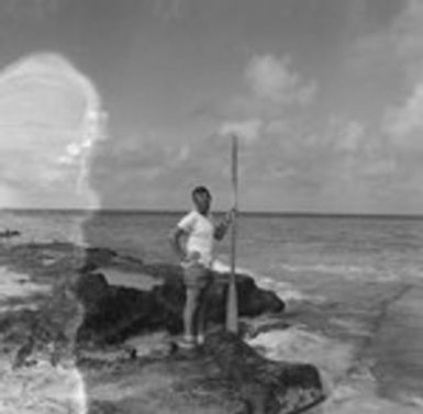 Walter H. Munk with oar during the Capricorn Expedition, Bikini Atoll area