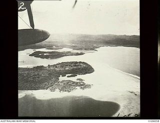 NEW BRITAIN. C. 1944. AERIAL VIEW OF GASMATA AIR FIELD (LOOKING NORTH) ON NEW BRITAIN