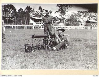 WONDECLA, ATHERTON TABLELAND, QLD. 1945-01-19. A MEMBER FROM HQ 24 INFANTRY BRIGADE PARTICIPATING IN THE MEDIUM MACHINE GUN RACE DURING THE 9 DIVISION GYMKHANA HELD AT THE HERBERTON RACECOURSE