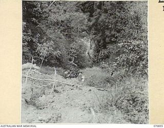 WAU - LAE ROAD, NEW GUINEA, 1944-02-20. THE BULOLO RIVER APPROXIMATELY 600 FEET BELOW THE ROAD SHELF PICTURED ABOUT 10 MILES FROM WAU ON THE ROAD TO SUNSHINE. THE ROAD IS OFTEN CLOSED THROUGH ..