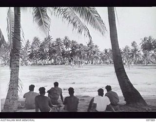 TARAWA ISLAND, GILBERT AND ELLICE ISLAND GROUP. 1945-09-27. CRICKET MATCH BETWEEN THE TEAM FROM HMAS DIAMANTINA AND THE TEAM FROM GILBERT ISLAND. HMAS DIAMANTINA IS VISITING THE ISLAND EN ROUTE TO ..