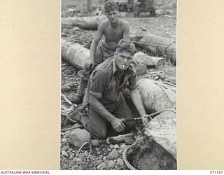 EVAPIA RIVER, NEW GUINEA, 1944-03-15. NX83916 SAPPER S. POTTS ( ) AND NX84317 SAPPER C. POTTS ( ), BROTHERS SERVING IN THE 2/4TH FIELD COMPANY, ROYAL AUSTRALIAN ENGINEERS, AT WORK ON THE MAIN ..