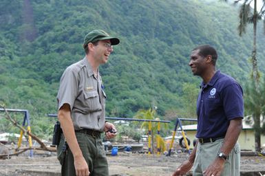 Earthquake ^ Tsunami - Pago Pago, American Samoa, October 9, 2009 -- Mike Reynolds, U. S. Park Services (USPS), and Kenneth Tingman, Federal Coordinating Officer for the Federal Emergency Management Agency (FEMA), discuss recovery operations and the spirit of teamwork in American Samoa. USPS and FEMA are among more than a dozen federal organizations who collectively have more than 300 people assisting local government and villages recover from a recent earthquake and tsunami. Dan Stoneking/FEMA