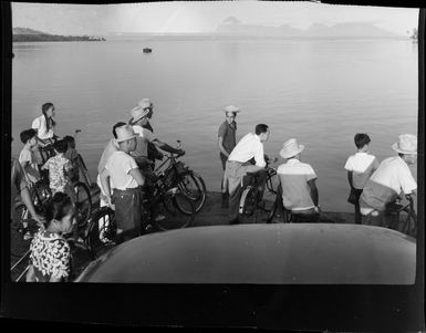 Locals watch from waterfront as TEAL (Tasman Empire Airways Limited) flying boat departs Tahiti