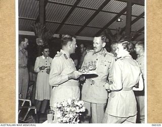 Port Moresby, New Guinea. 6 November 1943. At the farewell dinner, held at Headquarters, New Guinea Force, given to NX363 Lieutenant General Sir Iven MacKay KBE CMG DSO VD, to celebrate his ..