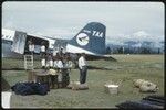 Goroka, Edwin Cook's supplies being loaded into an airplane