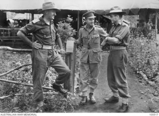 Lae, New Guinea. 1944-06-18. An informal group portrait of officers of 17 Lines of Communication Area Signals. Left to right: Major E. S. Cox, Officer in Charge, 2 Company; Lieutenant Colonel A. J. ..