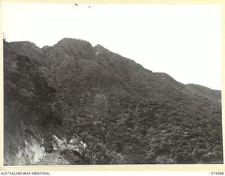 NEW GUINEA. 1944-07-09. A SECTION OF THE WAU-BULLDOG ROAD SHOWING THE DIFFICULT COUNTRY WHICH THE ROYAL AUSTRALIAN ENGINEERS HAD TO CONQUER DURING THE BUILDING OF THE ROAD