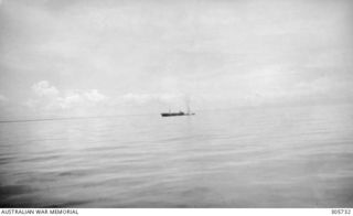 Off Porlock Harbour, New Guinea. 1943-03-08. After being hit by bombs in an attack by Japanese aircraft off Cape Nelson, the Dutch merchant vessel 'sJacob settles by the bow. She was taking part in ..