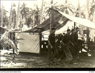 Madang, New Guinea. 1944-06-14. The tented Armoury, Wireless and Instrument Mechanics Workshop at 266th Light Aid Detachment, Headquarters 15th Infantry Brigade. The unit is located in Siar ..