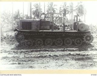 MADANG - ALEXISHAFEN ROAD, NEW GUINEA. 1944-05-26. THE SIDE VIEW OF A JAPANESE ARMOURED TRACTOR (POWERED BY A DIESEL ENGINE OF GERMAN DESIGN), WHICH WAS ABANDONED ON THE ROAD NEAR MILILAT ..