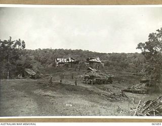 WAREO, NEW GUINEA. 1943-12-09. GENERAL VIEW OF THE BOMB WRECKED BUILDINGS IN THE AREA