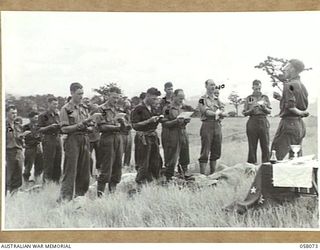 RAMU VALLEY, NEW GUINEA. 1943-10-20. CHURCH OF ENGLAND PARADE AT HEADQUARTERS, 21ST AUSTRALIAN INFANTRY BRIGADE, CONDUCTED BY PADRE H. NORMAN, OF 2/27 AUSTRALIAN INFANTRY BATTALION. SHOWN ARE:- ..