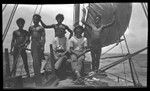 Men on sailboat, Bomatu Point, Kiriwina