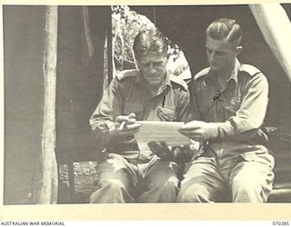 DUMPU, RAMU VALLEY, NEW GUINEA, 1944-02-11. VX108132 LIEUTENANT COLONEL R.R. MARSTON (1), COMMANDING OFFICER OF THE 57/60TH INFANTRY BATTALION, PICTURED WITH VX81067 MAJOR J.W.D. CONNELL (2), THE ..