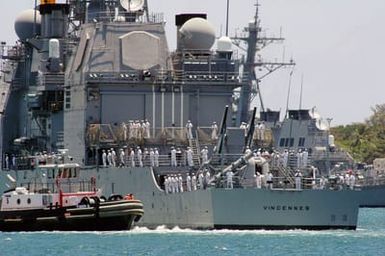 Portside view of the US Navy (USN) Ticonderoga Class Guided Missile Cruiser USS VINCENNES (CG 49) arriving at Pearl Harbor, Hawaii (HI), for a scheduled port visit. This is the ship's last port call before being decommissioned at San Diego, California (CA)