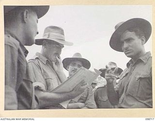 MISSION POINT, NEW GUINEA. 1945-11-09. AN IDENTIFICATION PARADE OF SUSPECTED JAPANESE WAR CRIMINALS WAS ARRANGED BY THE WAR CRIMES COMMISSION. MAJOR J.C. LOWRY, WAR CRIMES COMMISSION PRESIDENT, ..